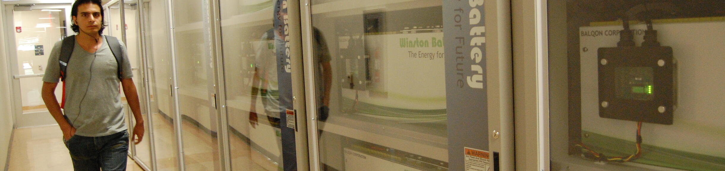 battery row with a student walking by