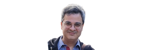 Dr. Amir Masoumi headshot, man with glasses and plaid shirt smiling