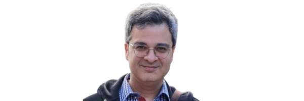 Dr. Amir Masoumi headshot, man with glasses and plaid shirt smiling