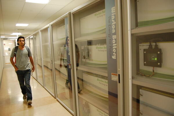 battery row with a student walking by